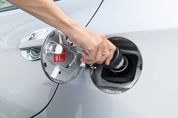 istock Hand opening the oil filler cap 494415402