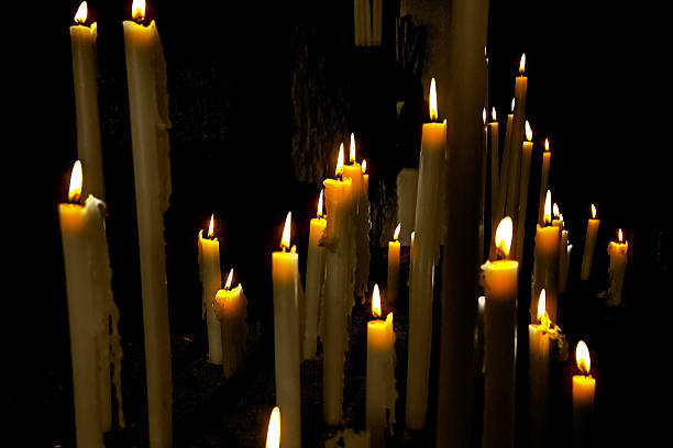 istock long burning candles with mysterious aspect 494415837