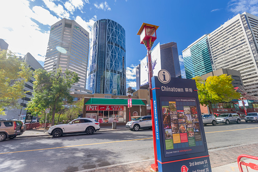 Calgary, Alberta, Canada - September 20, 2015:  Chinatown sign on the right side. Chinese restaurant and downtown buildings on the background. 