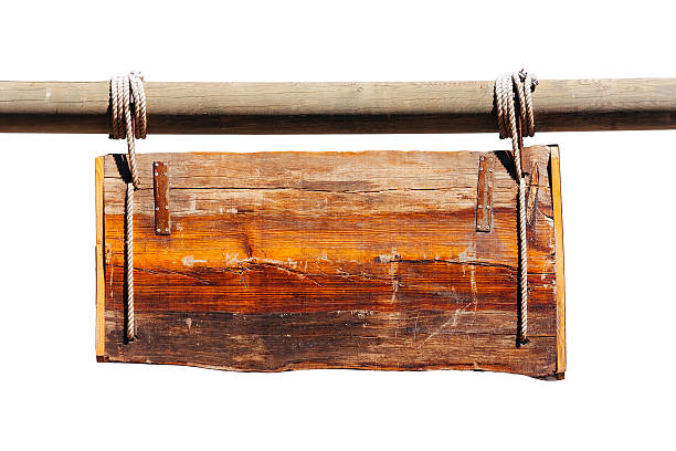 A triangular vintage wooden  box for cleaning wheat from the husk. A rusty metal cross is fixed on the axis. Isolated on white sunny day shot