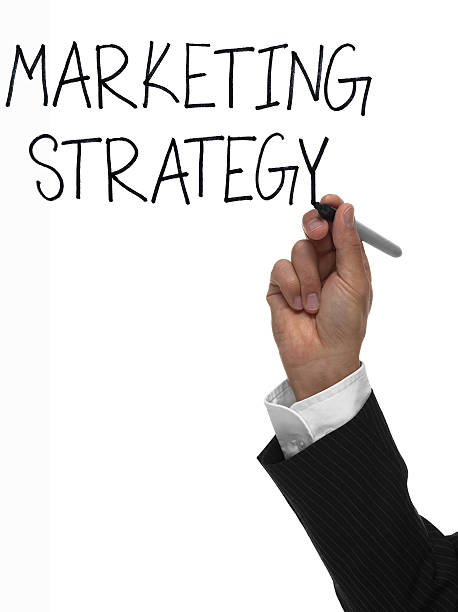 istock Hand writing the words marketing strategy 494417203