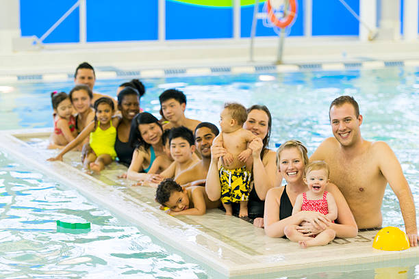 istock Families at the pool 494417743