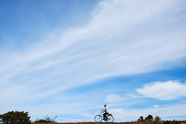 Biking in a plain landscape stock photo