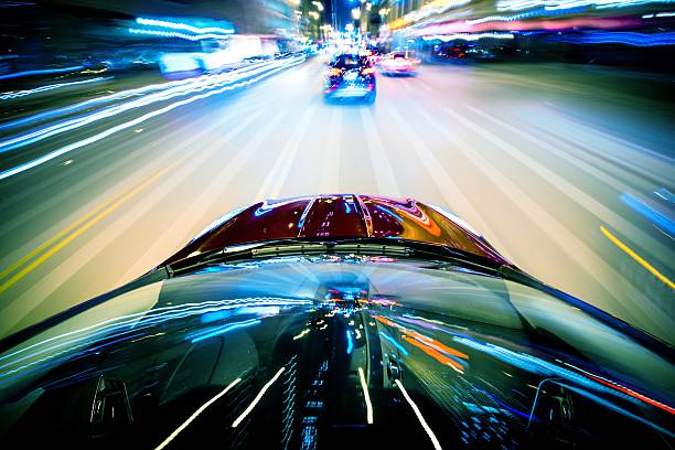 Nightly City Traffic Nightly City Traffic Motion Blurs. Colorful Urban Illumination in Motion Blur. City Streets Speeding Car. street racing stock pictures, royalty-free photos & images