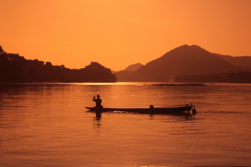 A fishing boat on the Mekong River near Luang Prabang in central Laos of Laos in South East Asia.