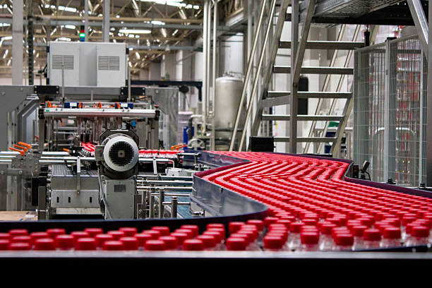istock Bottles on conveyor belt in factory 494418585