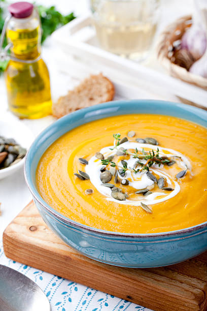 istock Roasted pumpkin and carrot soup with cream . 494419010