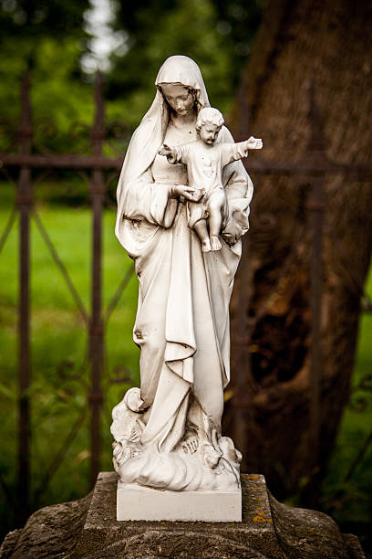 istock Virgin Mary's small statue on old Polish cemetery 494419105