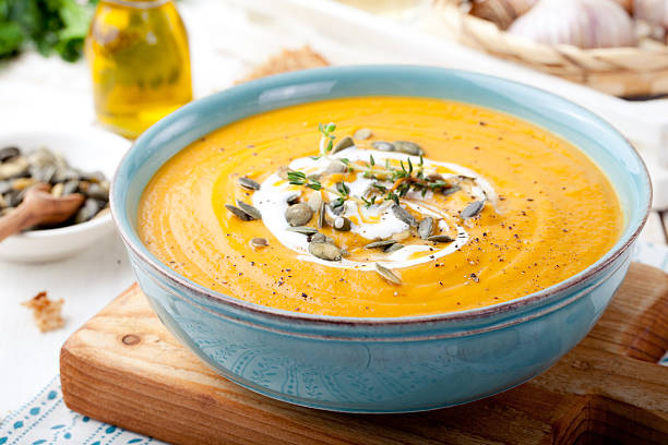 istock Roasted pumpkin and carrot soup with cream . 494419166