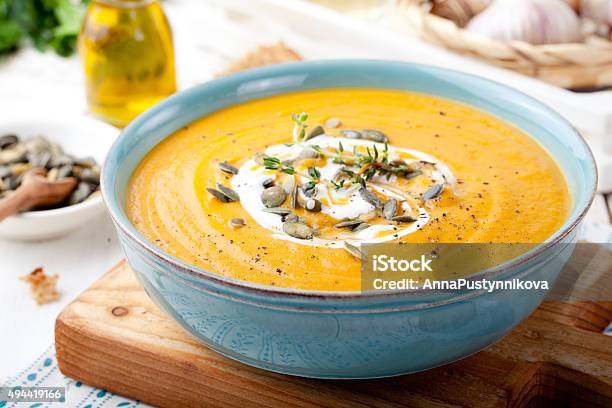 Roasted Pumpkin And Carrot Soup With Cream Stock Photo - Download Image Now - 2015, Autumn, Backgrounds