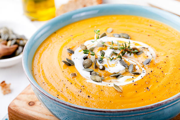 istock Roasted pumpkin and carrot soup with cream . 494419192