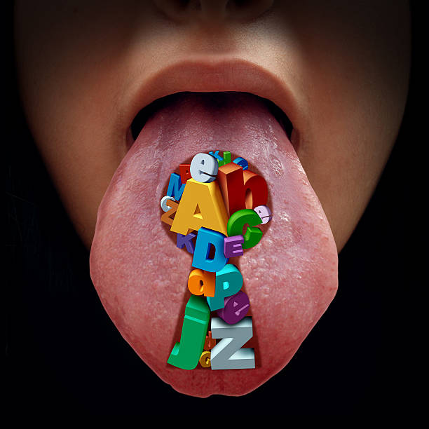 Language Solution Key Language solution education concept as a mouth with a tongue sticking out with a group of alphabet letters shaped as a key hole as a metaphor for speech therapy and reading and writing learning solutions. spelling bee stock pictures, royalty-free photos & images