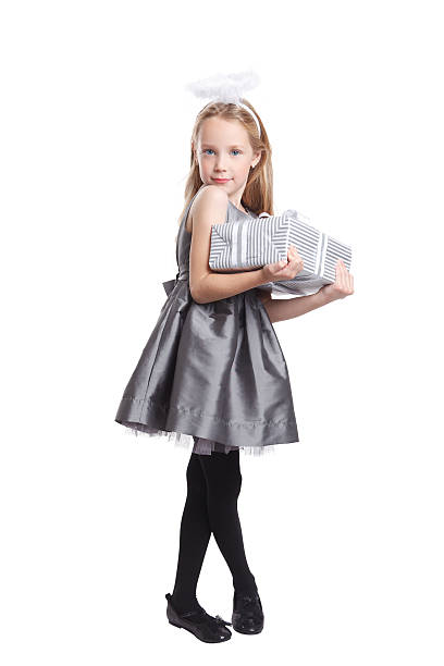 Cute little girl holding a present isolated stock photo