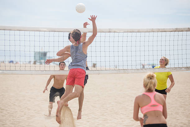 istock Volleyball player spiking ball against opposing team 494419768
