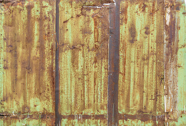 istock Fragment of a fence from a rusty metal sheets 494421332