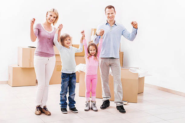 istock Cheerful family moving into a new house. 494431247
