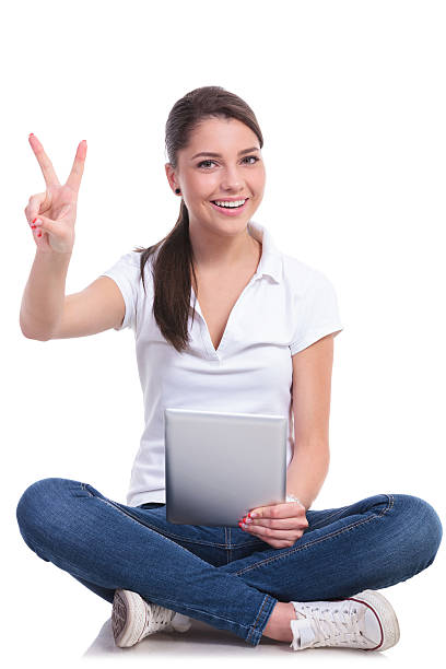 istock casual woman sits & victory & pad 494432149