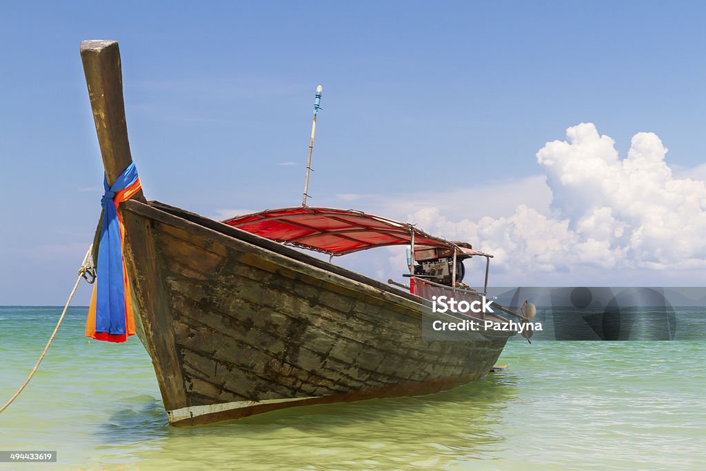 Longtail boat Traditional thai longtail boat landing on sea coast. Krabi, Andaman Sea, Thailand Andaman Sea Stock Photo