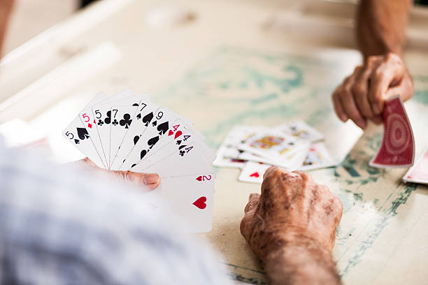 istock Old people playing cards - stock image 494433665