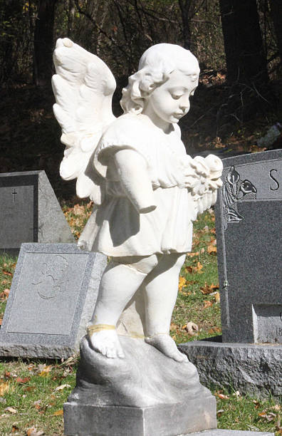 istock Angel with missing hand on a cemetery headstone 494435434