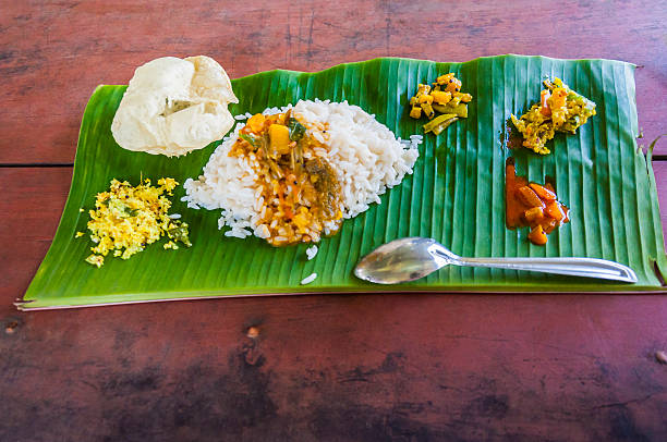 istock Traditional dinner Sadya on the palm leaf in Kerala India 494435846