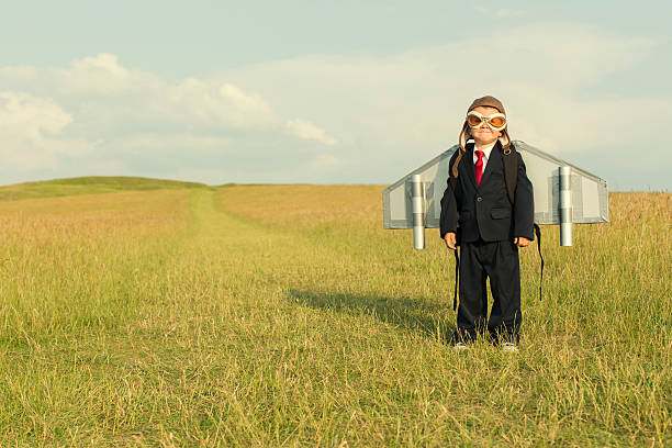 istock Young Boy Wearing Business Suit and Jetpack 494436097