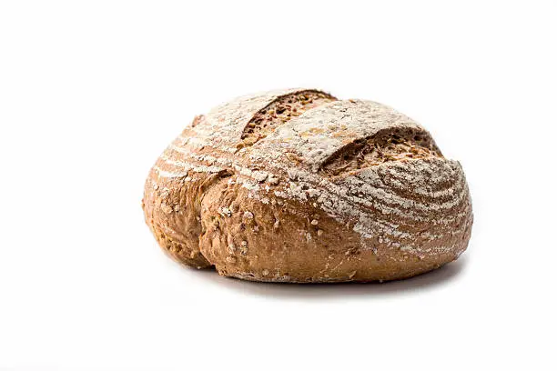 Fresh loaf of homemade bread on white background
