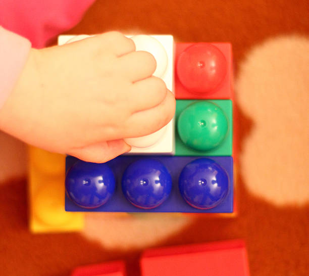 istock Little girl building a house 494436830