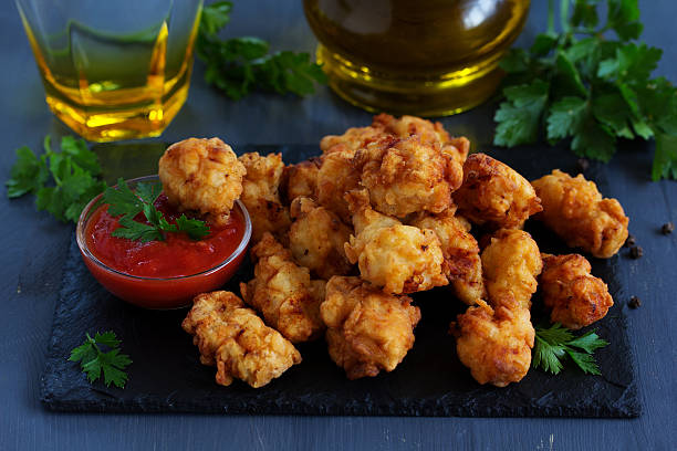 istock Fried nuggets of chicken breast with sauce. 494437182