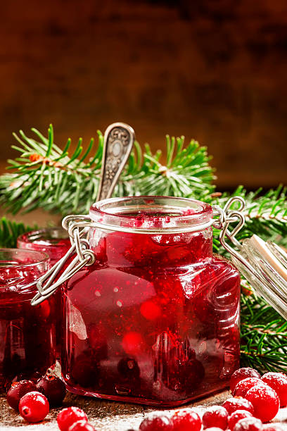 istock Winter cranberry sauce in glass jars 494438514