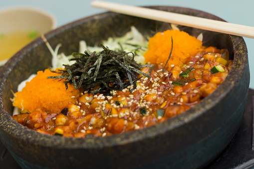 Fresh authentic Korean nakji bibimbap in hot steaming bowl