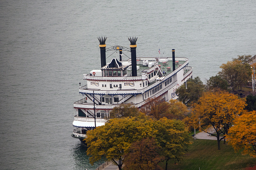 Detroit, MI, USA - October 24, 2015: A view of the Detroit Princess historic paddlewheeler ship docked in Detroit on the border between the United States and Canada.