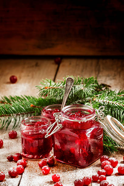 istock Winter cranberry sauce in glass jars 494439170