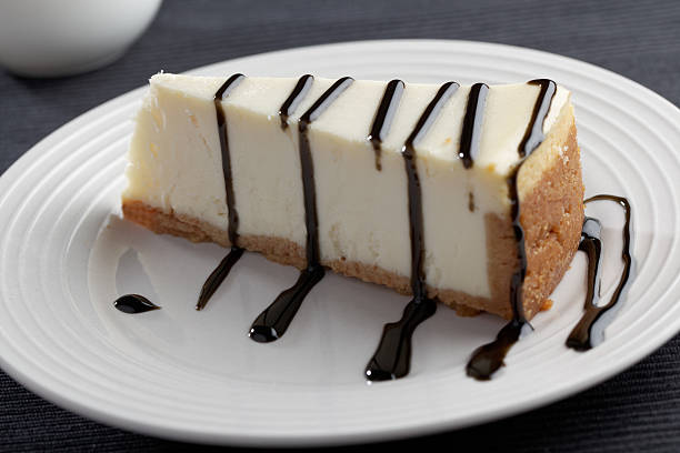 istock Slice of cheesecake with liquorice sauce 494440840