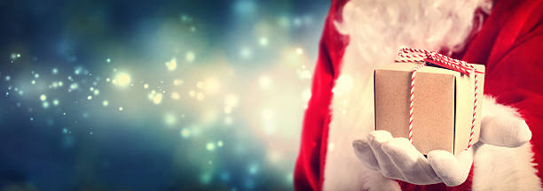 istock Santa Claus holding gift 494442064