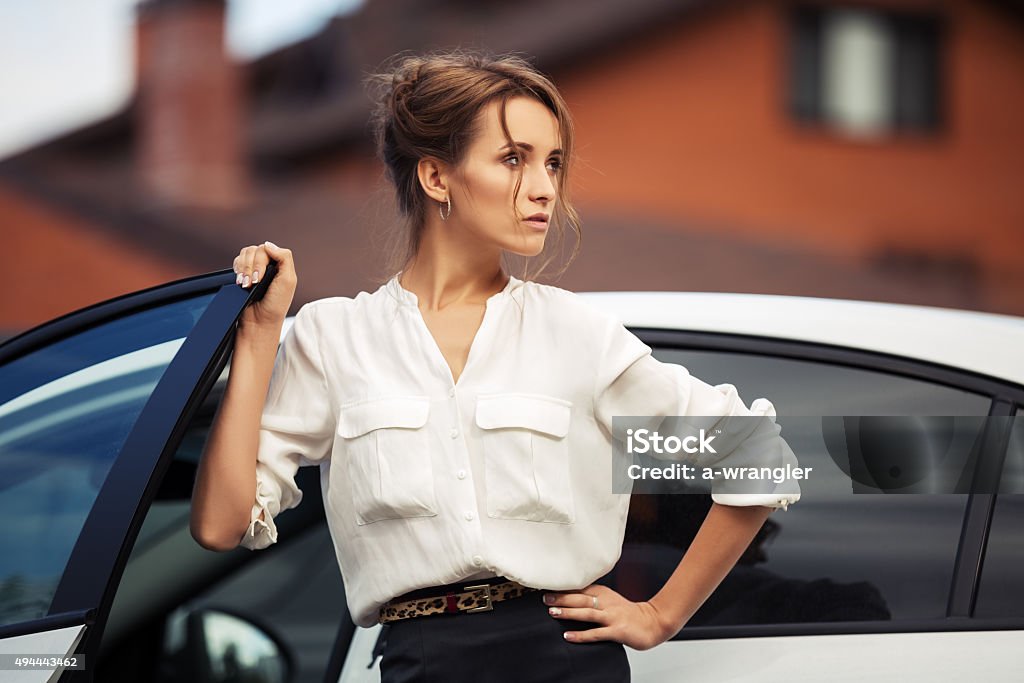 Young fashion business woman standing beside her car 20-24 Years Stock Photo