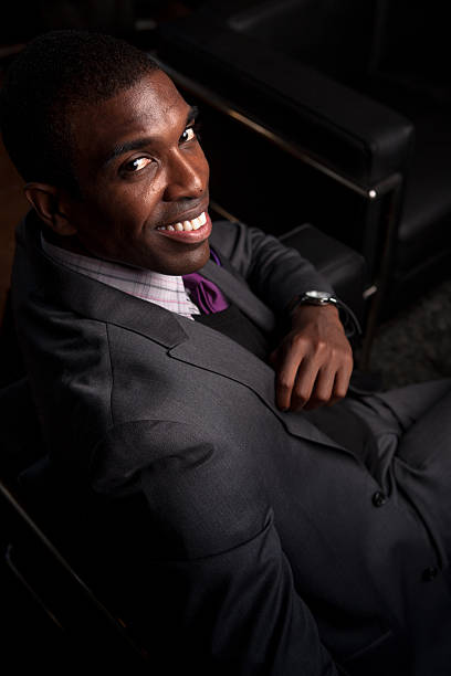 istock Smiling Young Man Wearing Suit 494444004