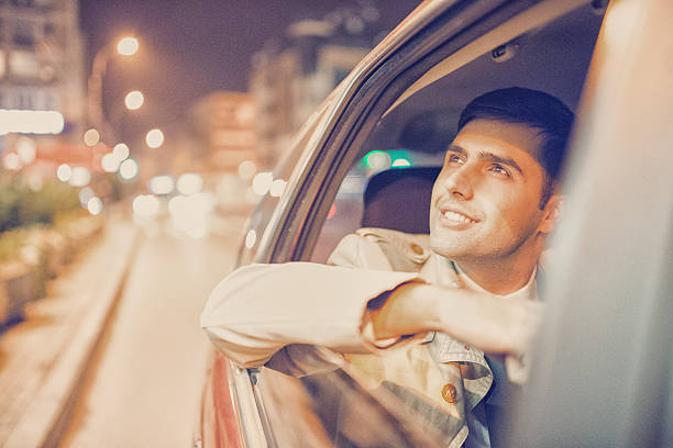 istock Businessman in a car at night 494444634