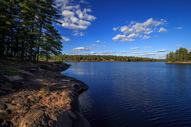 istock Rock shoreline and blue lake 494445290