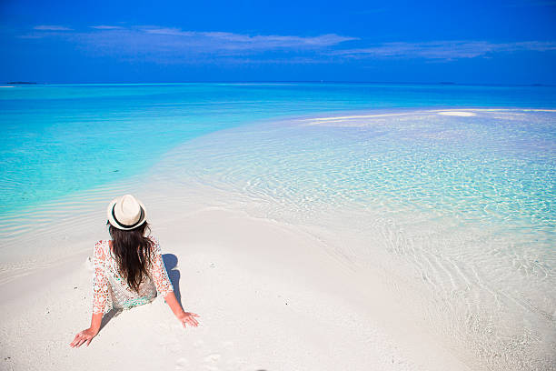 istock Young beautiful woman on beach during tropical vacation 494446888