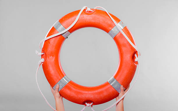 istock Life buoy ring in female hands 494447232