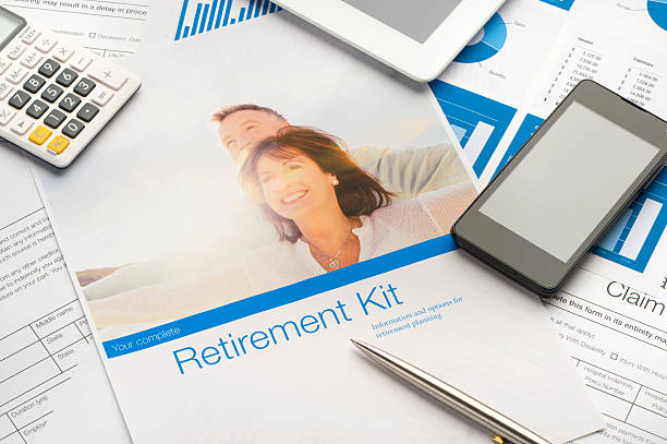 istock Retirement planning kit on a desk with paperwork. 494448358