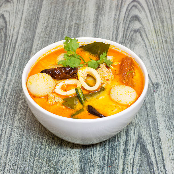 istock Tom Yum Kung-Thai spicy soup on wood background 494450426