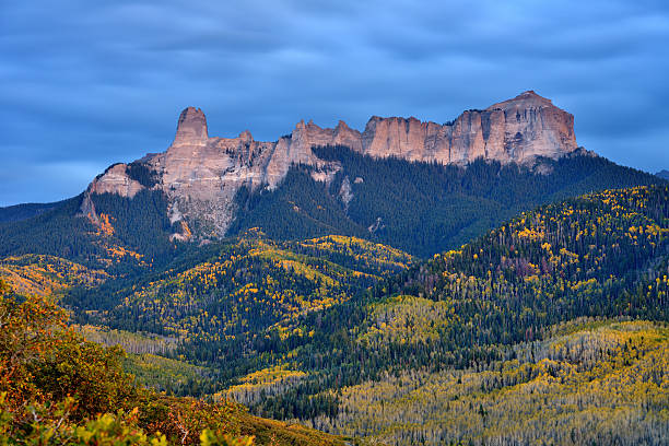 Dusk at Chimney Peak Autumn dusk view of Chimney Peak and Courthouse Mountain rock formations from Owl Creek Pass Road, near Ridgeway, Colorado, USA.  ridgeway stock pictures, royalty-free photos & images