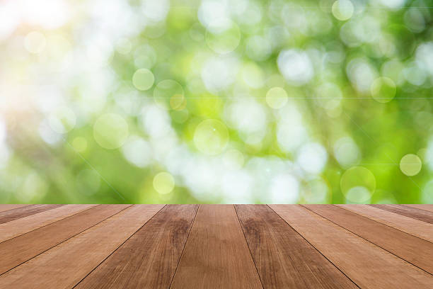 istock Bright spring with circular bokeh background and wooden floor 494464750