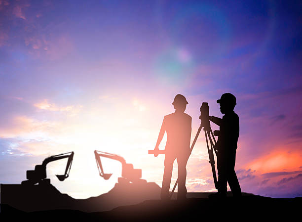istock silhouette survey engineer working  in a building site over Blur 494466046