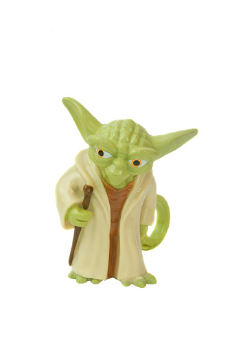 Adelaide, Australia - May 4, 2015: A Yoda bag tag isolated on a white background. Yoda is one of the most popular characters from the Star Wars universe. Merchandise from the star wars universe are highly sought after collectables.