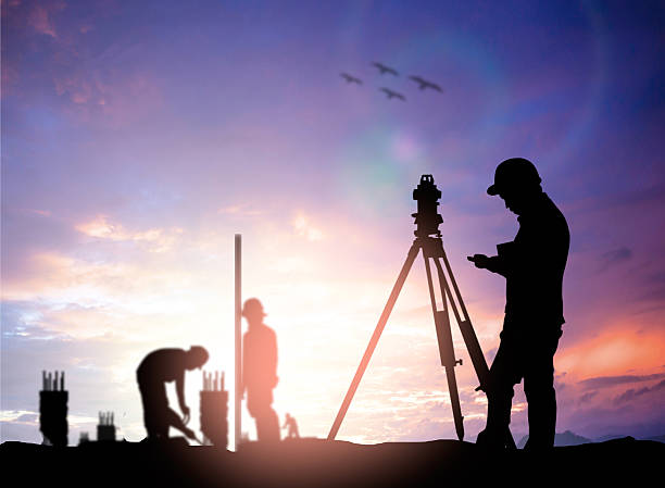 istock silhouette survey engineer working  in a building site over Blur 494466140