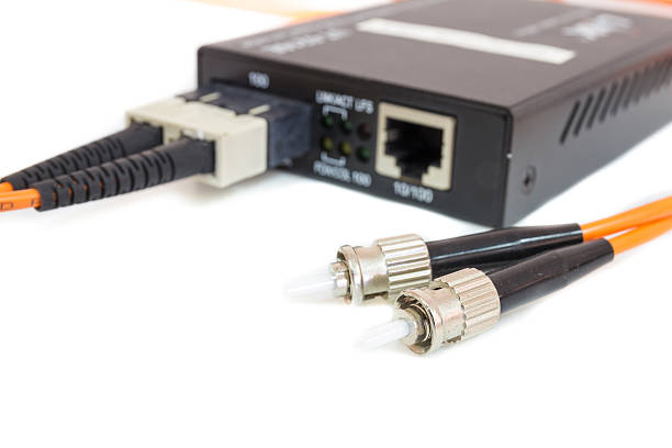 istock Close up metal fiber optic cable In front media converter 494466414