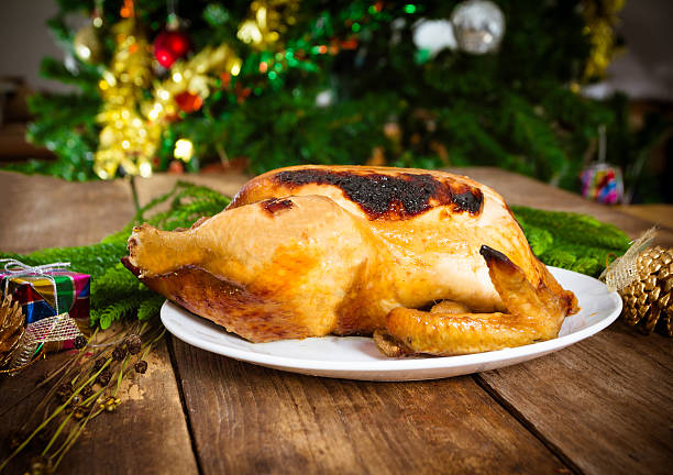istock Grilled chicken, Christmas themed dinner on old wood table 494466430